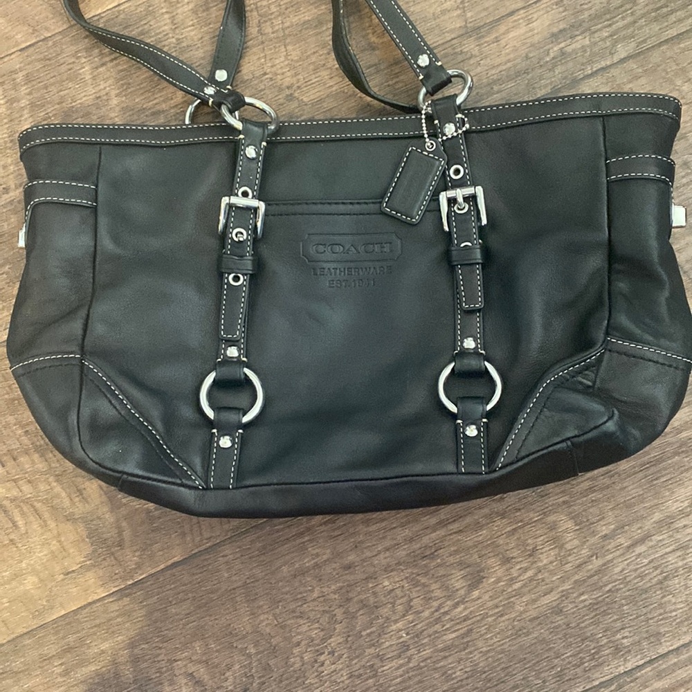 Black coach leather gently used purse.